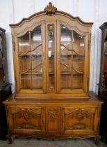 A French Louis XV style carved oak bookcase