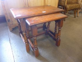 An Old Charm oak nest of two tables