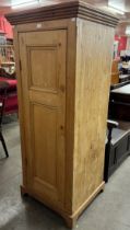 A Victorian pine cupboard