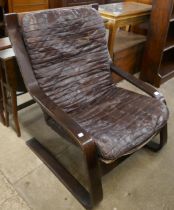 A bentwood and brown patchwork leather armchair