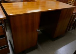 A small fitted teak desk