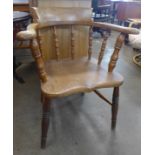 A Victorian elm and beech smokers bow chair