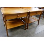 A pair of teak single drawer lamp tables