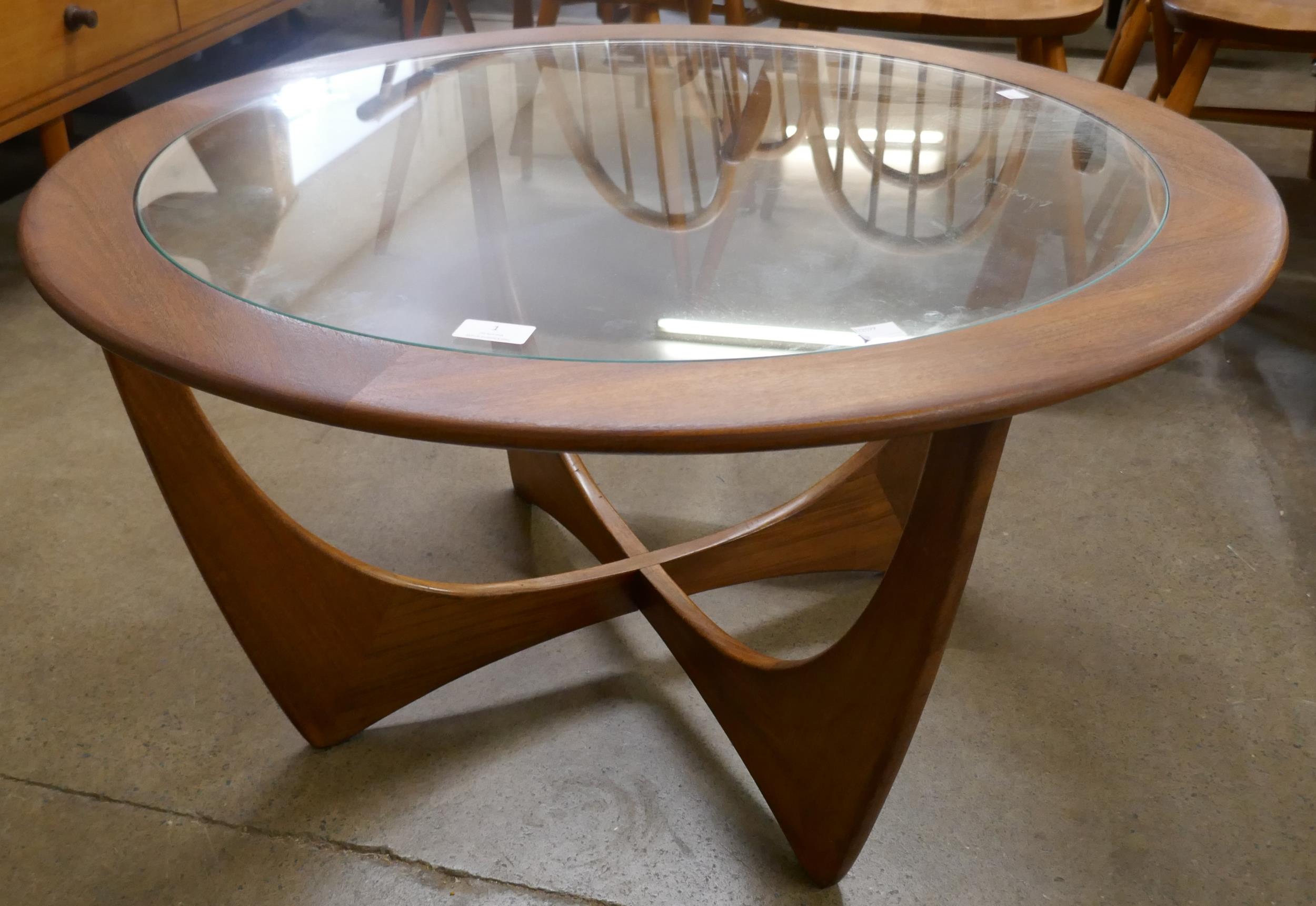 A G-Plan Astro teak and glass topped circular coffee table