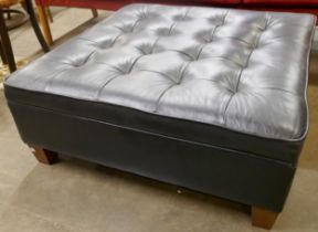 A black leather ottoman