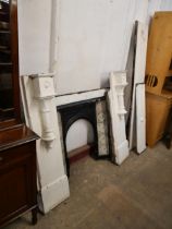 A Victorian slate fire surround with cast iron tiled insert