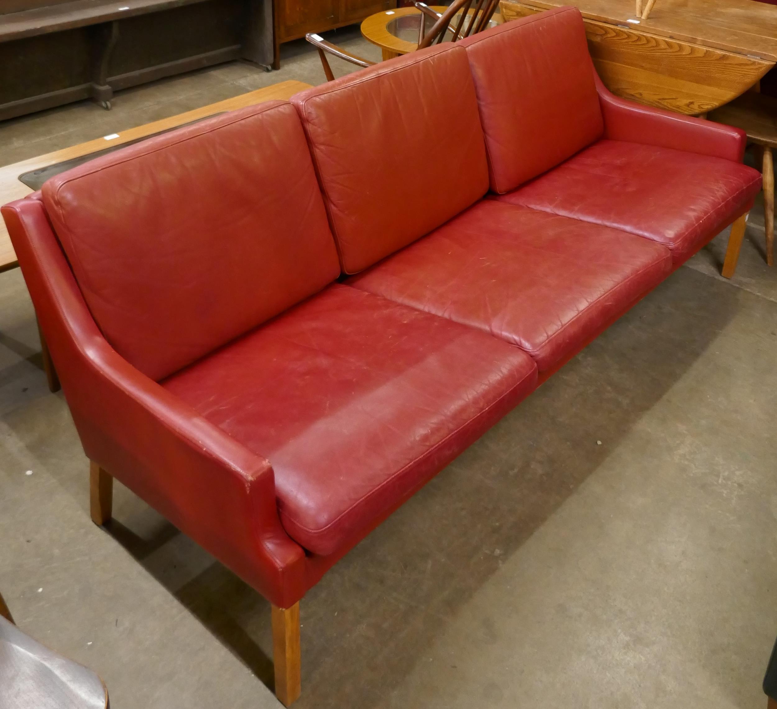 A Danish Thams Kvalitet crimson leather three seater sofa, designed by Rud Thygesen - Image 2 of 2