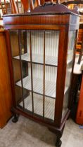 An Edward VII mahogany single door bow front display cabinet