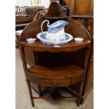 A George III mahogany corner washstand