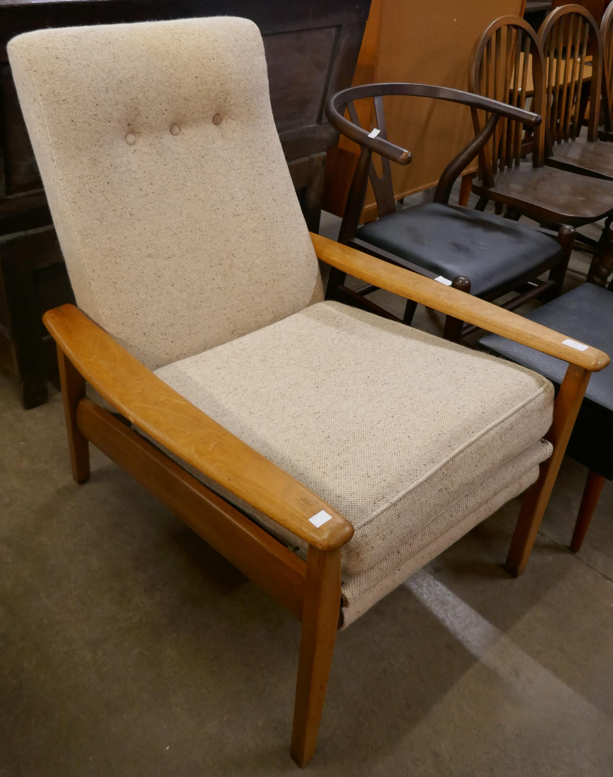 A teak reclining armchair