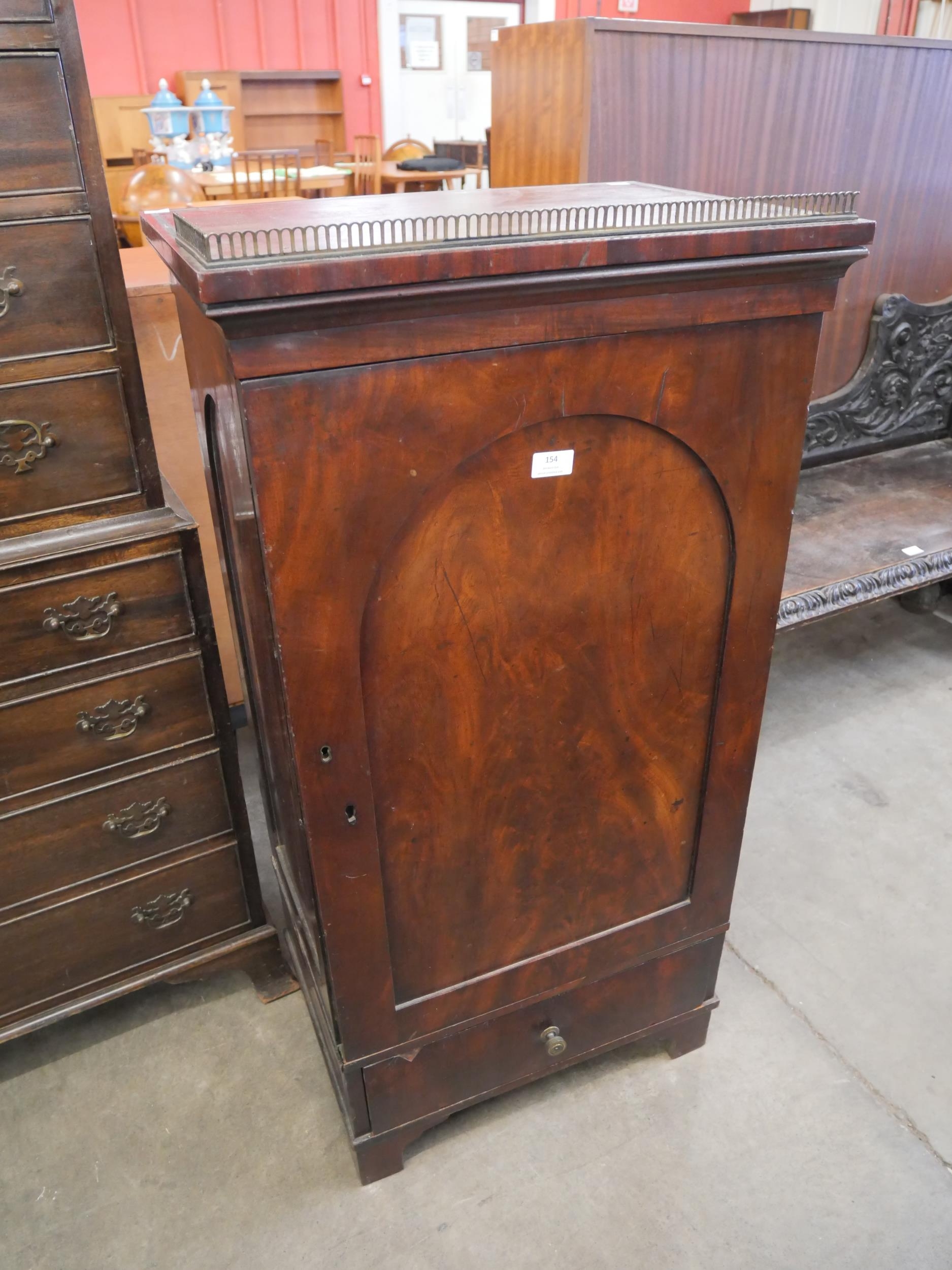 A Victorian mahogany single door cupboard