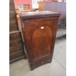 A Victorian mahogany single door cupboard