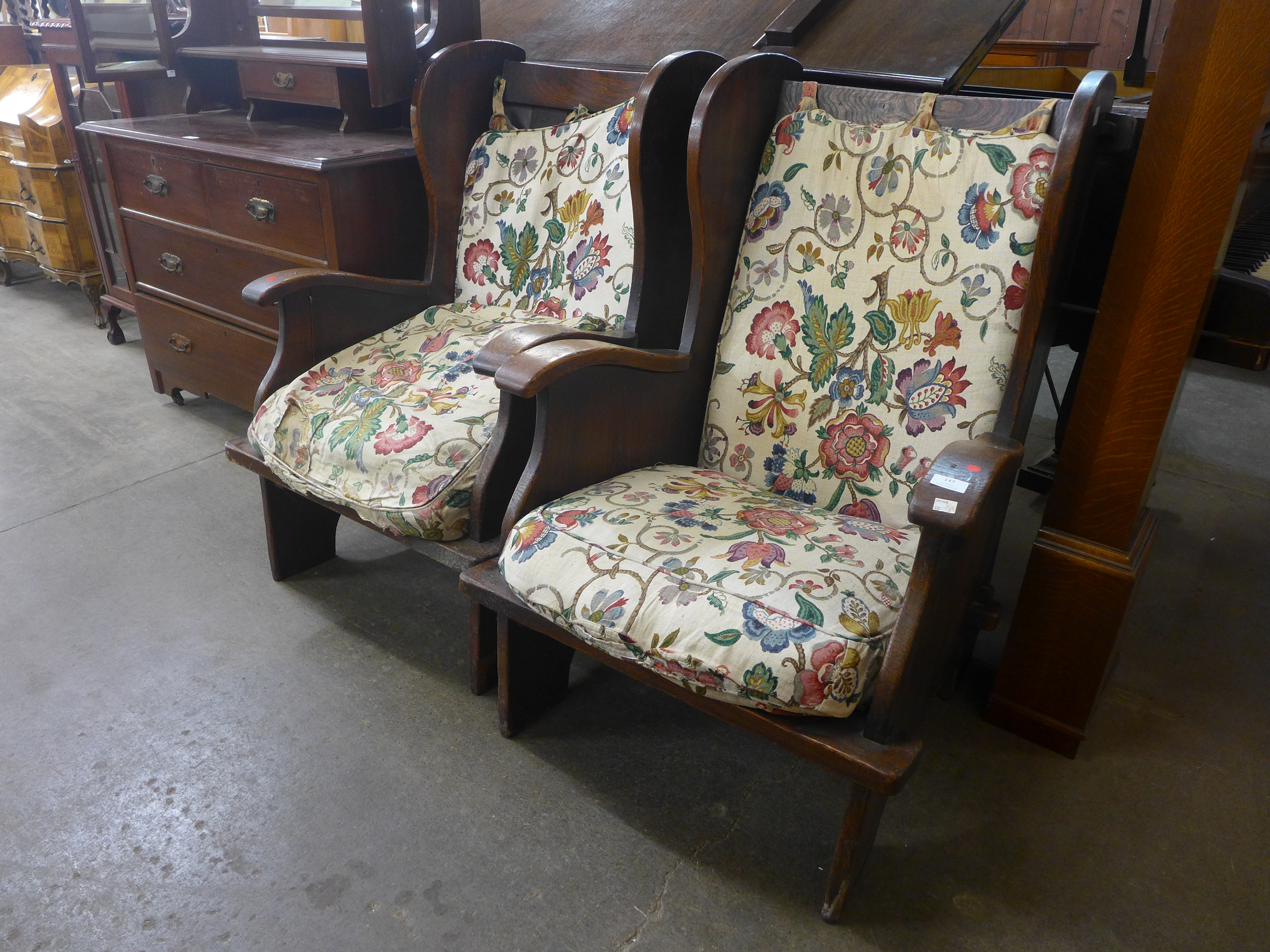 A pair of oak cottage armchairs