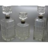 Three heavy crystal decanters (2+1), with silver collars, Israel Freeman & Son Ltd, London 1966 -