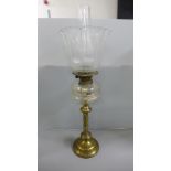 A brass and glass oil lamp **PLEASE NOTE THIS LOT IS NOT ELIGIBLE FOR IN-HOUSE POSTING AND PACKING**