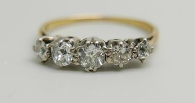 A yellow metal and five stone diamond ring, approximately 0.70ct weight, 2.1g, P
