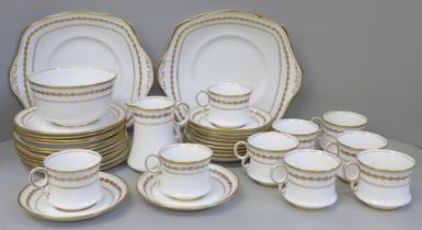 A Royal Albert 5430 tea service comprising two cake plates, twelve tea plates, eleven saucers,