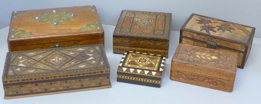 Six boxes; three inlaid wooden boxes, an oriental carved wooden box, a metal inlaid box and one