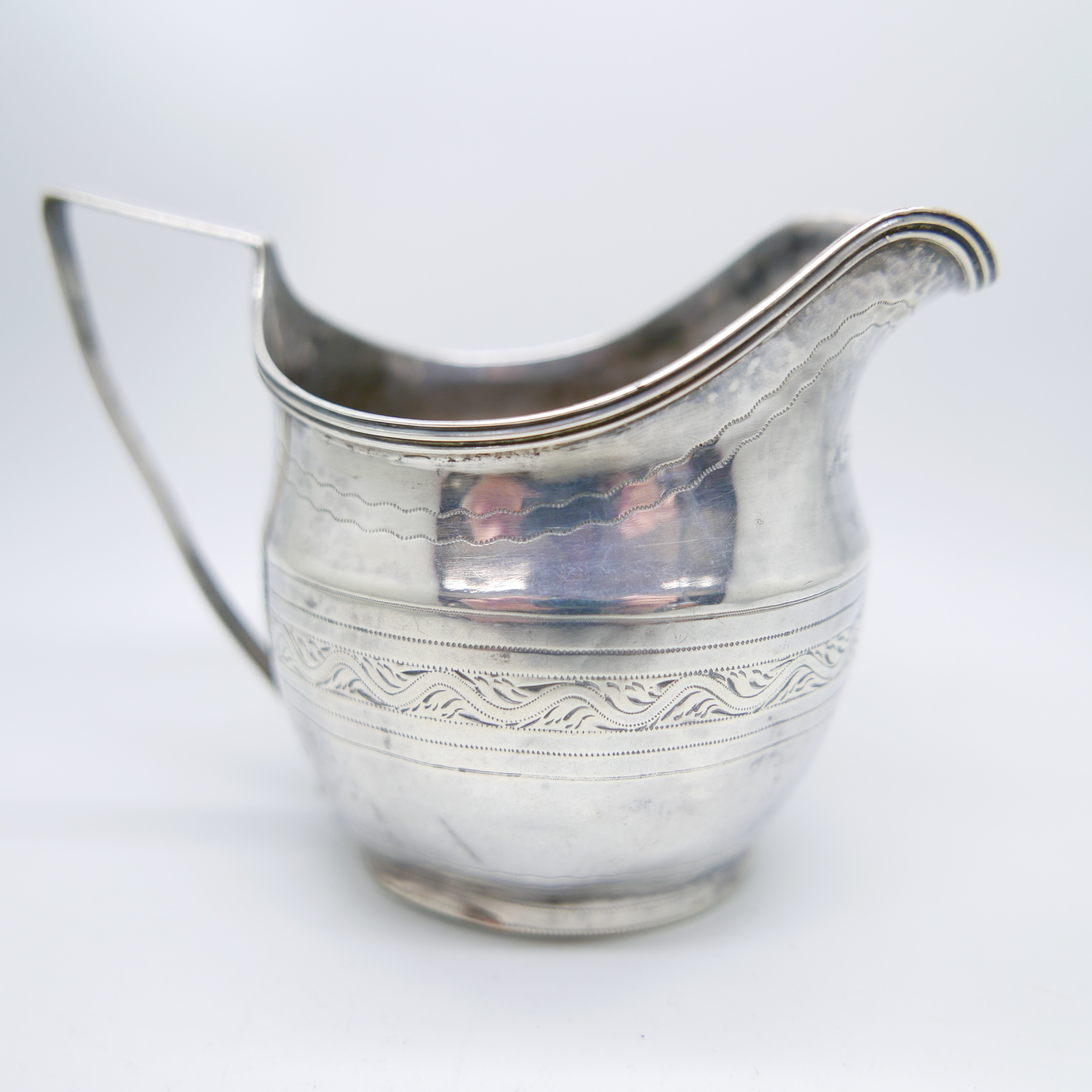 A George III silver cream jug, by John Merry, London 1805, 94.4g