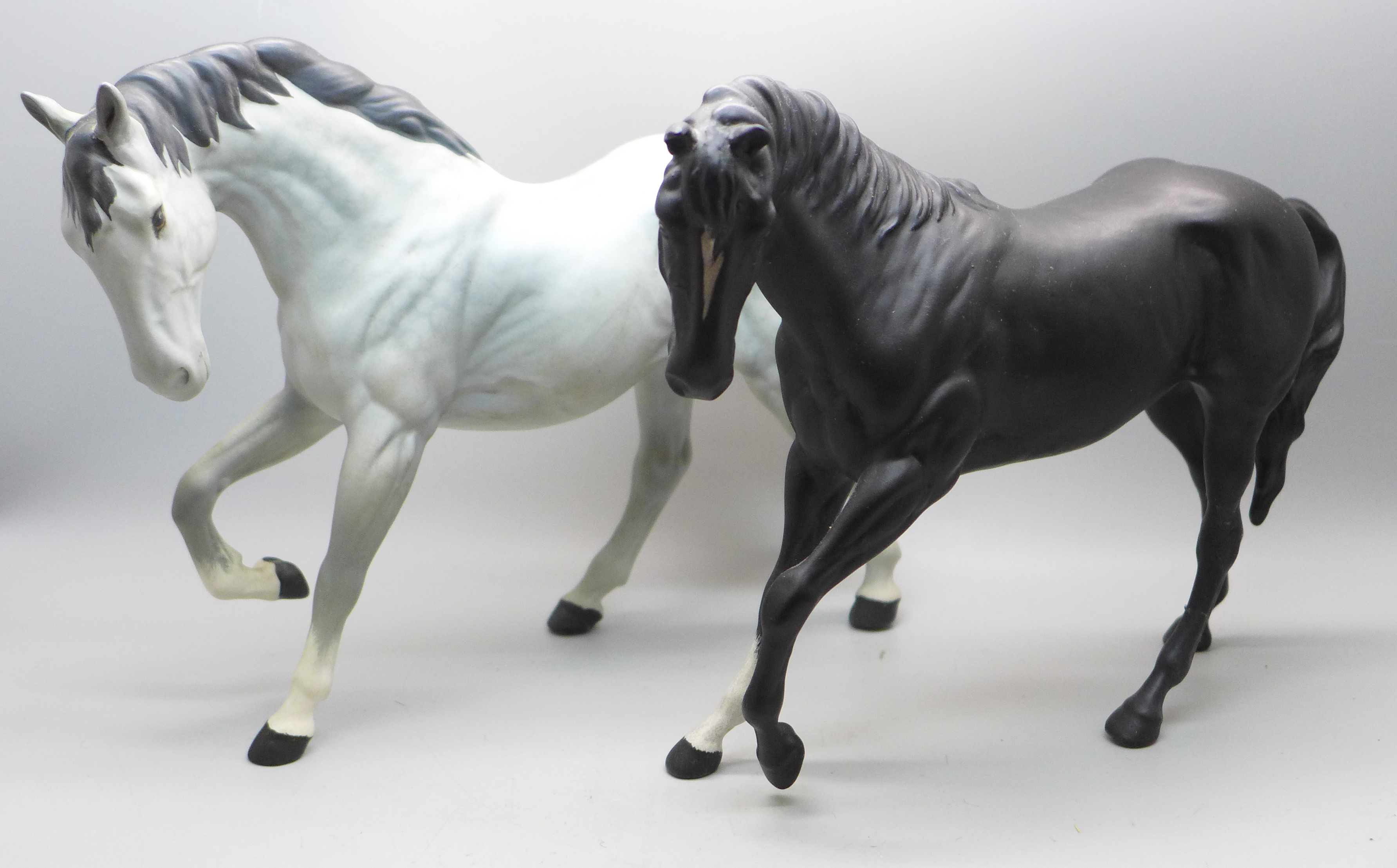 Two Beswick horse figures, hind leg on black horse restored