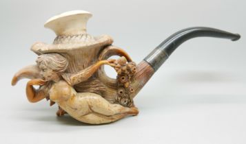 A large carved Meerschaum pipe of a lady reclining holding a bouquet of flowers, plated collar and