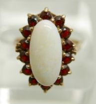 A 9ct gold, opal and garnet cluster ring, 3.9g, Q, opal 7mm x 15mm