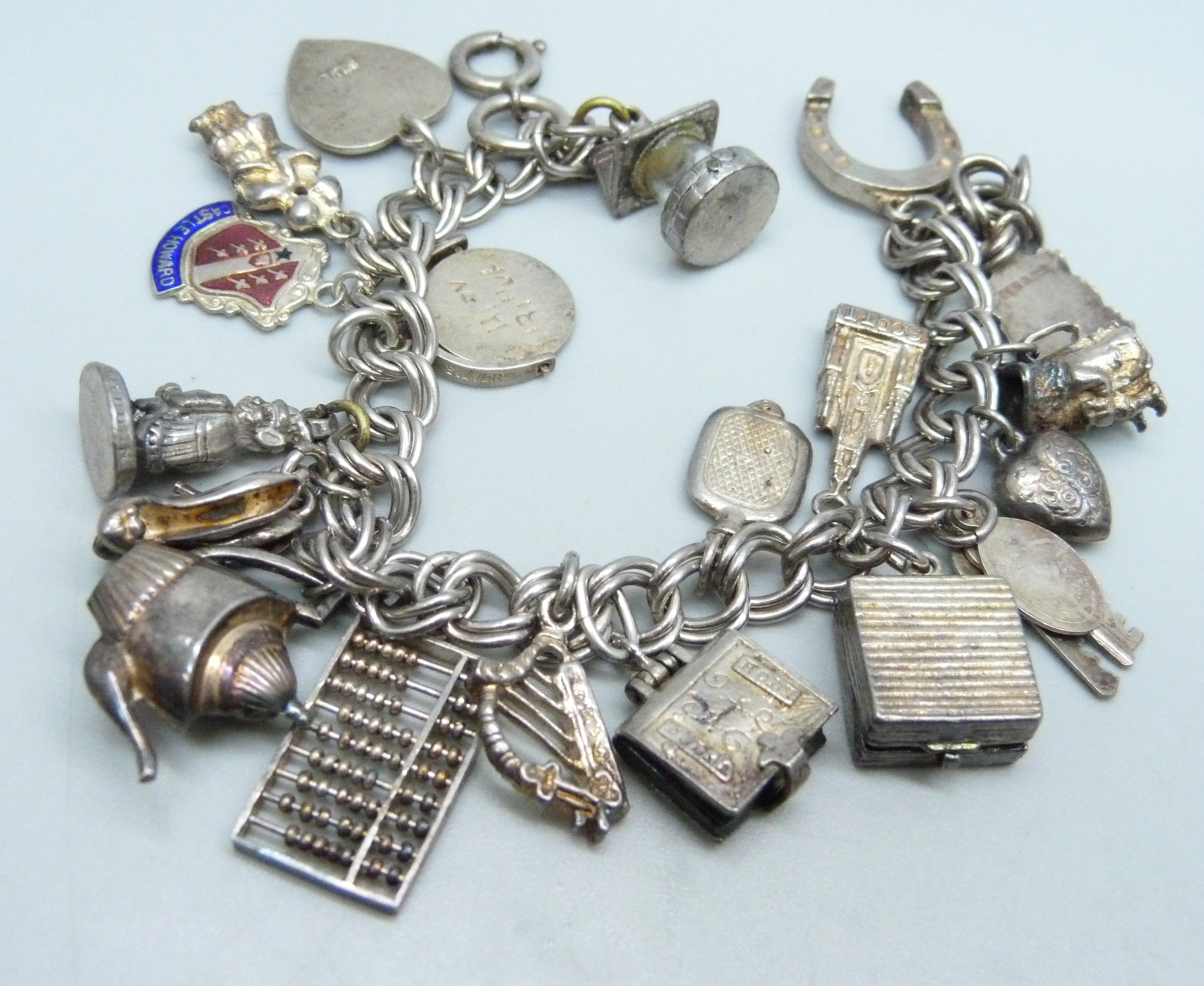 A silver charm bracelet, two silver pendants and a bracelet, 68g - Image 4 of 4