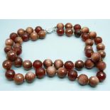 A heavy faceted goldstone and dark red stone bead double string necklace with silver clasp, 278g