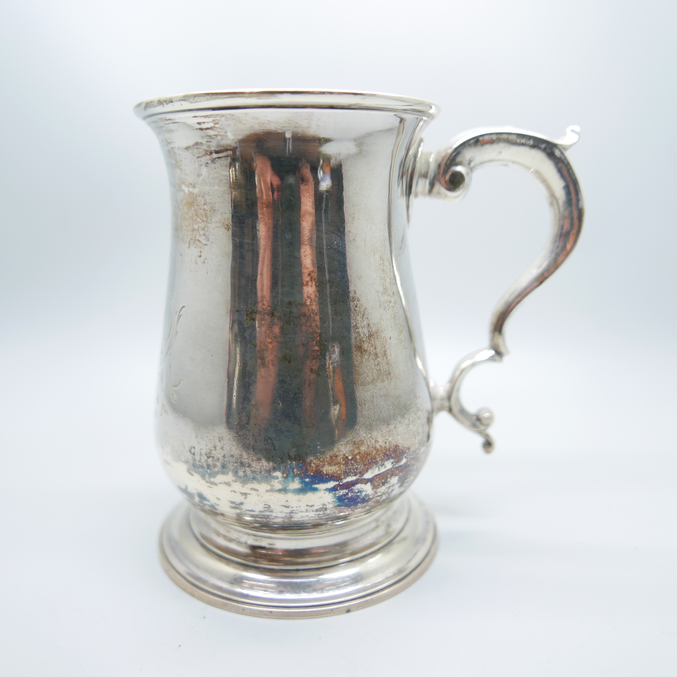 A George III silver tankard, London 1767, by William and James Priest with later engraving, double