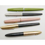 A cased Sheaffer pen with 14k gold nib with four Parker fountain pens