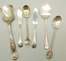 A pair of silver butter knives, a pair of silver golf club spoons and two silver preserve spoons,