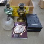 Two oil lamps lacking chimneys, a pair of Dartington glass champagne flutes, boxed and a 2019