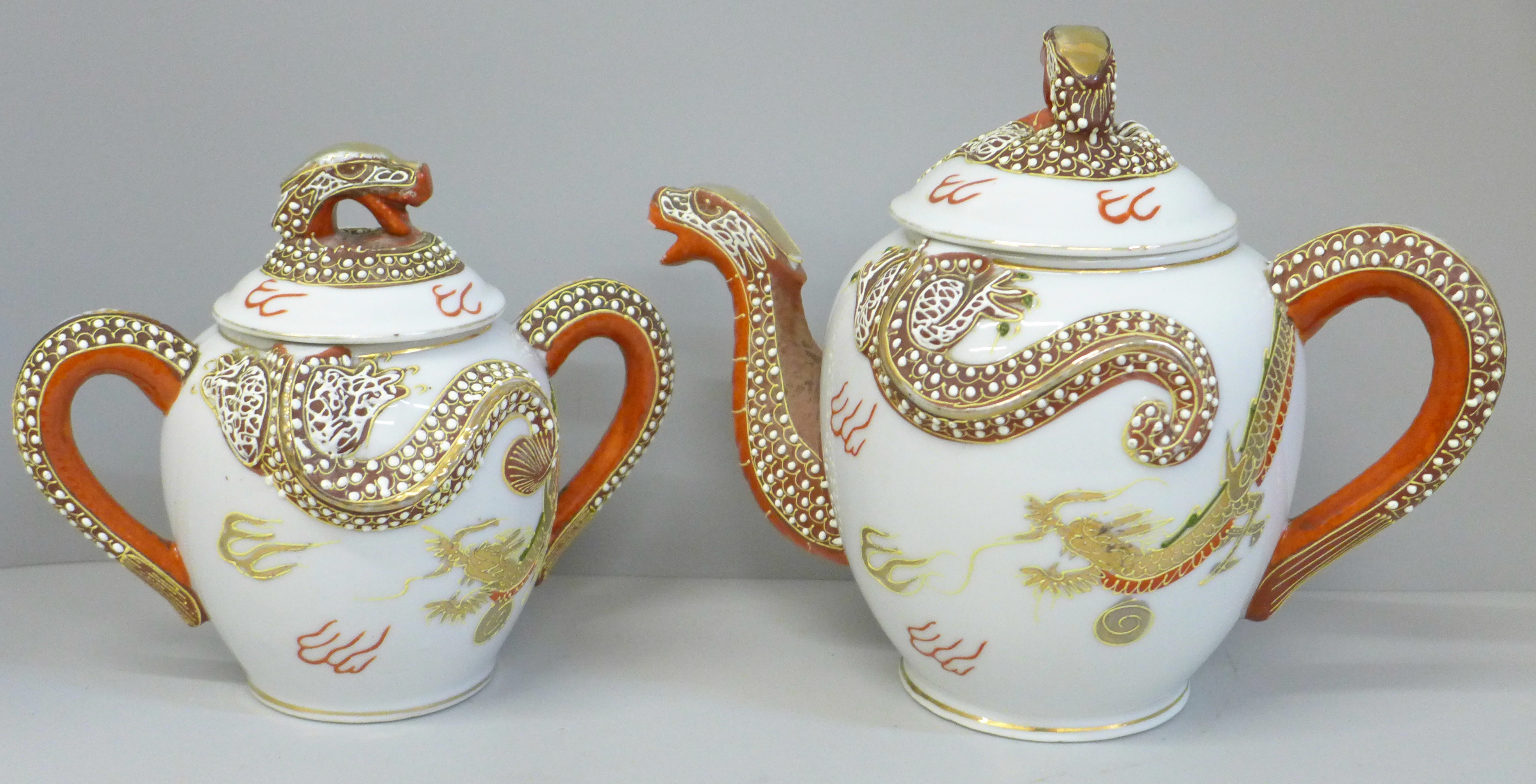 Vintage Japanese Moriage Dragonware; china teapot and a two-handled jar with lid