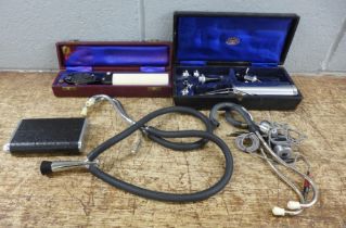Medical equipment; two stethoscopes and two other eye and ear instruments