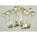 A collection of silver mustard spoons, 115g