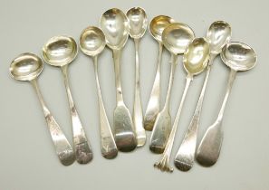A collection of silver mustard spoons, 115g