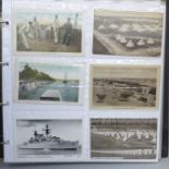Postcards; a large album of military related postcards, vintage to modern