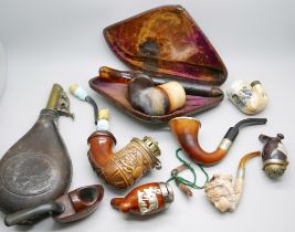 A powder shot flask and a box of Meerschaum pipes