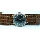 A 9ct gold Majex wristwatch with black dial on a crocodile leather strap, 31mm case