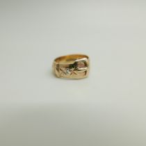 A 9ct gold and diamond buckle ring, 4.8g, N, shank a/f