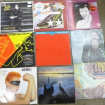 A collection of sixteen records, OMD, Eurythmics, Billy Joel, Duran Duran, etc.