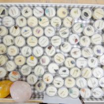 A collection of mineral and gemstone samples in plastic containers and two agate eggs **PLEASE