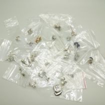 Twenty-five pairs of silver earrings
