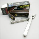 A Leatherman pocket survival tool, The Original, with leather case and outer box