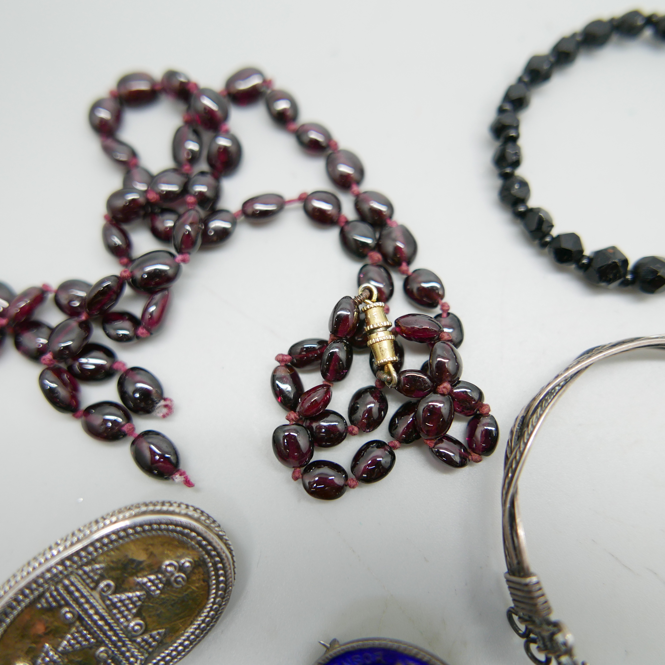 Two jet necklaces and brooch, two garnet necklaces, one a/f, three silver brooches, one white - Image 2 of 3