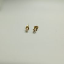 A pair of 9ct gold and diamond ear studs
