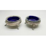 A pair of silver salts with liners, Birmingham 1909, Henry Williamson Ltd., weight with liners 136g,
