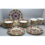 A collection of Royal Crown Derby 1128 pattern Imari; two tea plates, three large saucers, two