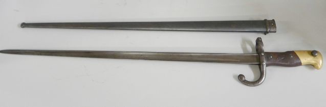 A French gras bayonet with scabbard, marked St. Ettienne 1875