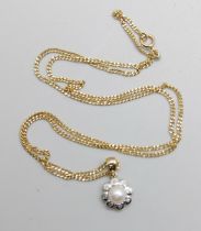 A 9ct gold, diamond and pearl pendant on a chain, the fastener marked 750, total weight 4.3g,
